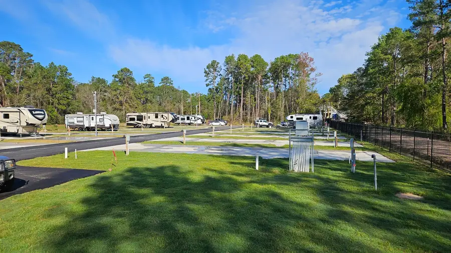 Full hookup RV site with concrete pad at Gleneagles RV Resort Conroe TX